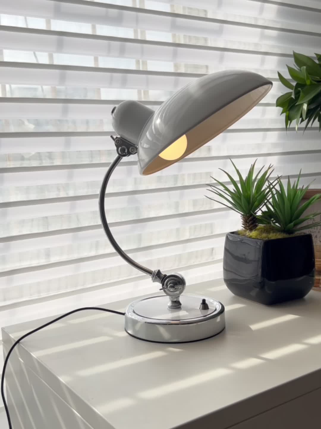 Minimalist and fashionable office desk lamp with creative ironwork, featuring exquisite black or white paint finish, serving as an artistic decorative ambiance table lamp, complete with a bulb.